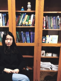 Photo Of Ina Choi Sitting In Front of Bookcases