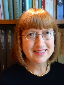 Headshot of Nancy S. Steinhardt In Front Of A Bookcase