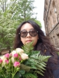 Photo Of Dr. Yoonjung Kang Holding A Bouquet Of Flowers