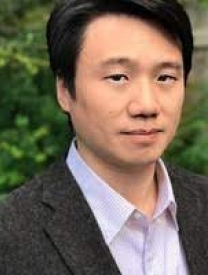 Headshot Of Dr. Huang-wen Lai Standing In Front Of Greenery